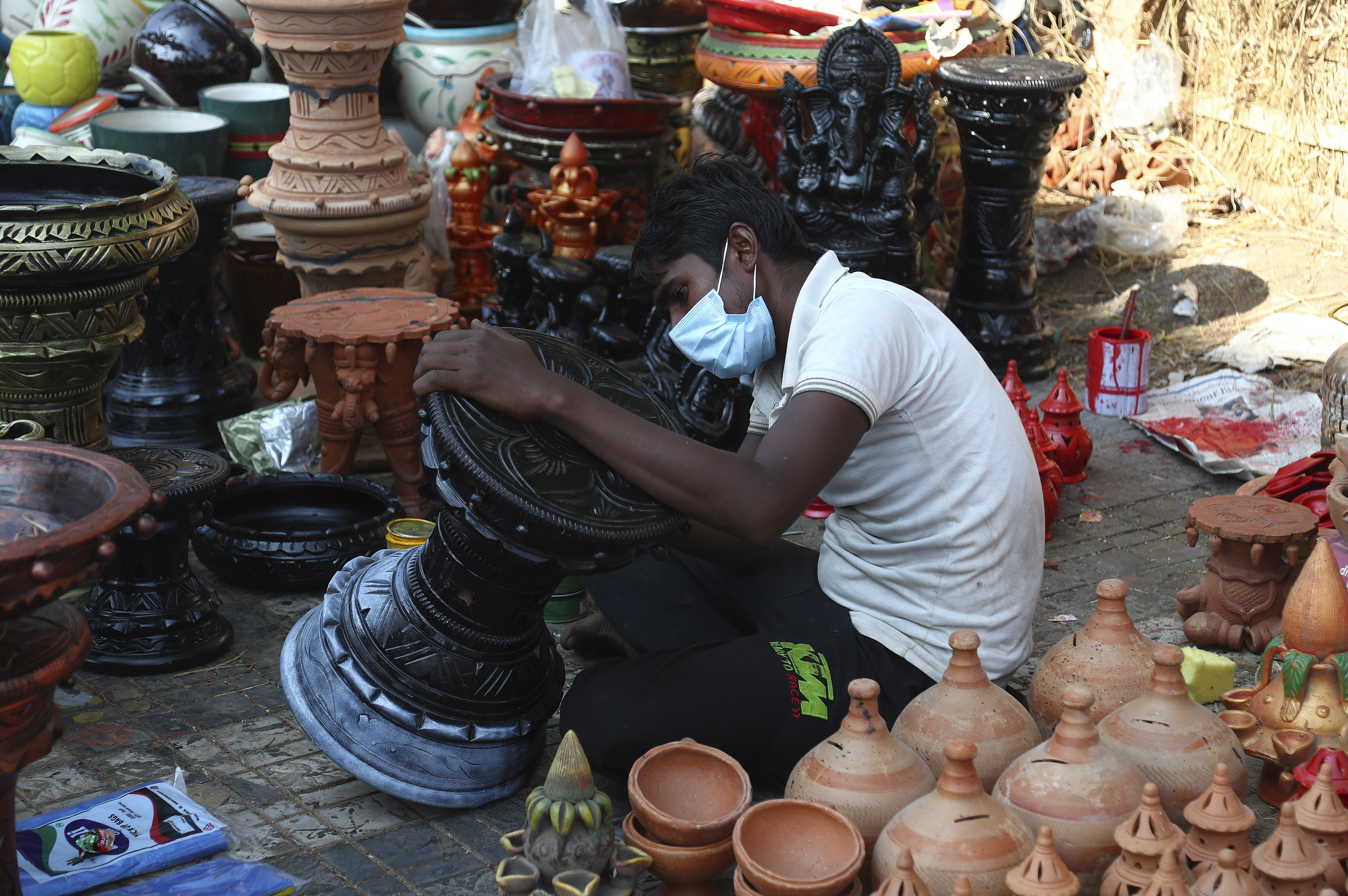 The Latest: Cases soaring in New Delhi ahead of festival